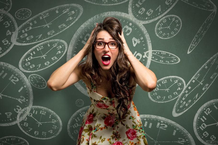 woman stressing out in front of chalkboard